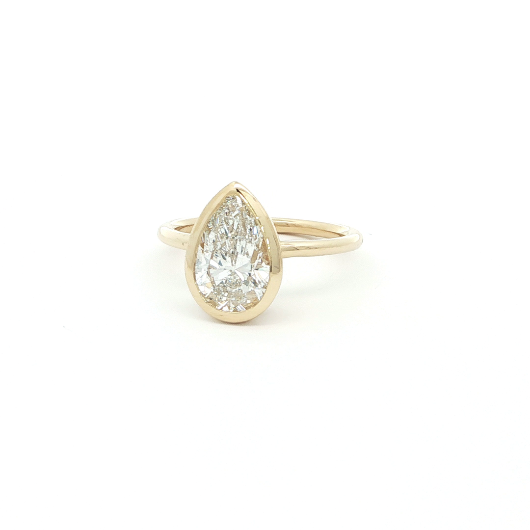 Pear Cut Diamond Solitaire Ring in Yellow Gold