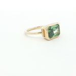 Load image into Gallery viewer, Gold Solitaire Ring with Emerald Cut Green Emerald
