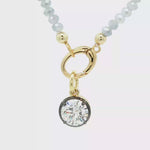 Load and play video in Gallery viewer, Two-Tone Gold-Plated Beaded Necklace with Round Crystal Pendant
