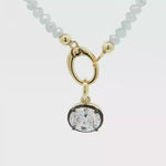 Load and play video in Gallery viewer, Two-Tone Gold Plated Beaded Necklace with Oval Crystal Pendant
