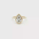 Load and play video in Gallery viewer, Pear Cut Diamond Solitaire Ring in Yellow Gold
