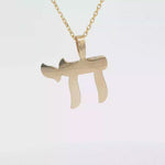 Load and play video in Gallery viewer, 14KT Yellow and White Gold Chai Pendant - Small or Medium

