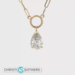 Load and play video in Gallery viewer, 14KT Yellow Gold Bezel Necklace with Pear-Cut Lab-Grown Diamond Pendant (2.03 ct)

