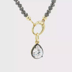Load and play video in Gallery viewer, Two-Tone Gold-Plated Beaded Necklace with Pear Crystal Pendant
