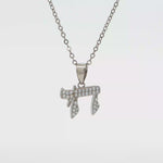 Load and play video in Gallery viewer, Sterling Silver or Yellow Gold-Plated Chai Necklace with Round CZ
