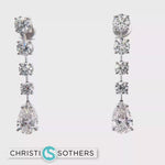 Load and play video in Gallery viewer, 14KT White Gold Dangle Earrings with Pear Cut Diamonds
