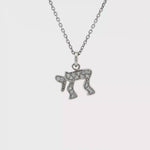 Load and play video in Gallery viewer, Sterling Silver Wavy Chai Necklace with Round Brilliant-Cut CZ Pendant
