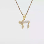 Load and play video in Gallery viewer, Sterling Silver or Yellow Gold-Plated Chai Necklace with Round CZ
