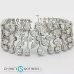 Load and play video in Gallery viewer, 14KT White Gold Pear-Cut Diamond Bangle Bracelet (22.82 cttw)