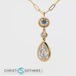 Load and play video in Gallery viewer, 14KT Yellow Gold Triple-Stone Bezel Necklace with Lab-Grown Round &amp; Pear Diamonds (4.04 cttw)
