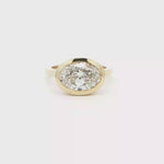 Load and play video in Gallery viewer, 14KT Yellow Gold Oval Lab-Grown Diamond Bezel Ring
